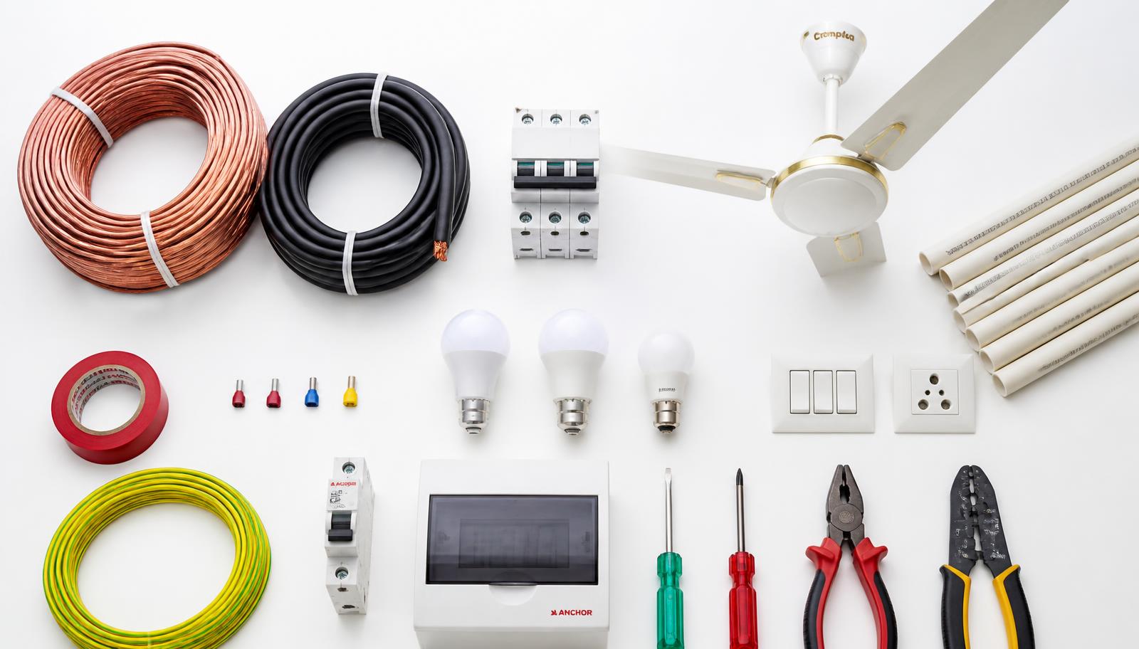 Assortment of genuine electrical products: cables, breakers, bulbs and tools